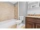 Bathroom featuring a bath tub, neutral walls, and granite countertops at 4908 Willow Lane Ln, Austell, GA 30106