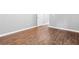 Bedroom featuring wood-look flooring, neutral walls, and bright white trim at 4908 Willow Lane Ln, Austell, GA 30106