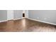 Bedroom featuring wood-look flooring, neutral walls, and bright white trim at 4908 Willow Lane Ln, Austell, GA 30106