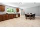 Well-lit kitchen with stainless appliances, wooden cabinets and dining table at 4908 Willow Lane Ln, Austell, GA 30106