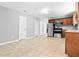 Spacious kitchen with stainless steel appliances, tile floors, and plenty of cabinet space at 4908 Willow Lane Ln, Austell, GA 30106