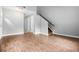 Spacious living area showcasing wood floors, white trim, and a staircase at 4908 Willow Lane Ln, Austell, GA 30106