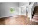 Open living area featuring wood floors, a window, and staircase at 4908 Willow Lane Ln, Austell, GA 30106