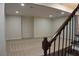Large, carpeted basement with stairway and neutral colored walls with plenty of room at 1062 Lena Nw St, Atlanta, GA 30314