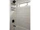 Bathroom features modern, white tiling and built in shelf at 1062 Lena Nw St, Atlanta, GA 30314