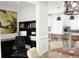 Dining room with modern light fixtures, view of kitchen with island, and a black office set against a large painting at 1062 Lena Nw St, Atlanta, GA 30314