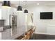 Elegant dining room featuring a stylish chandelier and seamless access to the kitchen at 1062 Lena Nw St, Atlanta, GA 30314