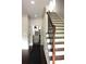 Grand entry showcasing a staircase and hardwood floors creating a welcoming and elegant atmosphere at 1062 Lena Nw St, Atlanta, GA 30314