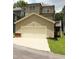 Inviting home with an attached garage, a quaint balcony, and tidy landscaping at 1062 Lena Nw St, Atlanta, GA 30314