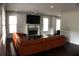 Bright living room featuring a fireplace, large windows, crown moulding and comfortable seating at 1062 Lena Nw St, Atlanta, GA 30314