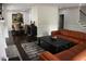 Open-concept living room and dining area with hardwood floors, comfortable seating, and an elegant chandelier at 1062 Lena Nw St, Atlanta, GA 30314
