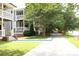 Neighborhood view showing the sidewalk with mature trees in a walkable neighborhood at 1062 Lena Nw St, Atlanta, GA 30314