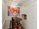 Small bar area boasts white trim, a mini popcorn maker, and colorful art at 1667 Willow Way, Woodstock, GA 30188