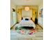 Bedroom with a murphy bed surrounded by natural wood toned cabinets and a colorful area rug at 1667 Willow Way, Woodstock, GA 30188