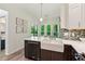 Bright kitchen with a stylish backsplash, large farmhouse sink, and stainless steel appliances at 1667 Willow Way, Woodstock, GA 30188