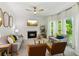 Bright living room featuring neutral sofas, a fireplace, and large windows with natural light at 1667 Willow Way, Woodstock, GA 30188