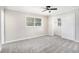 Neutral bedroom featuring a ceiling fan, carpet, and a closet with mirrored doors at 2403 Tiffany Pl, Decatur, GA 30035
