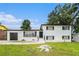 Charming two-story home featuring a brick exterior, well-manicured lawn, and a driveway leading to an attached garage at 2403 Tiffany Pl, Decatur, GA 30035