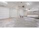 Spacious garage with two doors, bar, and storage at 2403 Tiffany Pl, Decatur, GA 30035