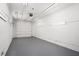 Empty garage featuring a white door and lighting at 2403 Tiffany Pl, Decatur, GA 30035