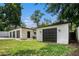 Multiple garages with dark doors provide ample parking and storage space in this well-maintained home at 2403 Tiffany Pl, Decatur, GA 30035