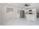 Well-lit kitchen features white cabinets, stainless steel appliances, and gray backsplash for a contemporary feel at 2403 Tiffany Pl, Decatur, GA 30035