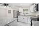Eat-in kitchen with stainless steel appliances, including range and refrigerator, and updated gray-flecked countertops at 2403 Tiffany Pl, Decatur, GA 30035