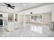 Bright living room featuring modern ceiling fan, sleek marble floors, and oversized window for great natural light at 2403 Tiffany Pl, Decatur, GA 30035