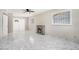 Living room featuring marble floors, an electric fireplace, and large windows for plenty of natural light at 2403 Tiffany Pl, Decatur, GA 30035