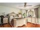 Spacious bedroom with hardwood floors and beautiful vanity and mirror at 338 Saratoga Pl, Riverdale, GA 30296