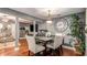 Open concept dining area with hardwood floors and stylish decor at 338 Saratoga Pl, Riverdale, GA 30296