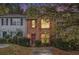 Charming brick townhome featuring well-maintained landscaping and cozy curb appeal at 338 Saratoga Pl, Riverdale, GA 30296