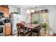 Bright kitchen with dining area and lots of natural light from the window at 338 Saratoga Pl, Riverdale, GA 30296