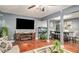Inviting living room with hardwood floors, fireplace, and view of dining room at 338 Saratoga Pl, Riverdale, GA 30296
