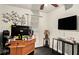 Office setup with desk, monitor and TV; perfect for remote work or study at 338 Saratoga Pl, Riverdale, GA 30296