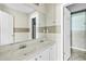 Bathroom featuring dual sinks, neutral tones, and lots of natural light at 750 Ambrose Ln, Atlanta, GA 30349