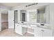 Bathroom featuring dual sinks, glass shower, garden tub, and spacious vanity at 750 Ambrose Ln, Atlanta, GA 30349