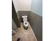 Half bathroom with a toilet, baseboards, and two-tone walls at 750 Ambrose Ln, Atlanta, GA 30349