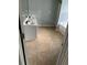 Bathroom featuring a tile floor, white vanity, and a separated tub at 750 Ambrose Ln, Atlanta, GA 30349