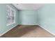 Bedroom featuring plush carpet, and window at 750 Ambrose Ln, Atlanta, GA 30349