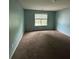 Bedroom with carpet, window and natural light at 750 Ambrose Ln, Atlanta, GA 30349