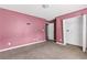 Bedroom with neutral carpet and an open closet at 750 Ambrose Ln, Atlanta, GA 30349