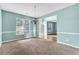 Dining room with natural light, decorative chandelier, and neutral paint, creating an inviting atmosphere at 750 Ambrose Ln, Atlanta, GA 30349