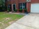 Charming two-story brick home with a well-maintained lawn and a two car garage at 750 Ambrose Ln, Atlanta, GA 30349