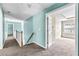 Hallway with blue accent wall leading to a bedroom with natural light at 750 Ambrose Ln, Atlanta, GA 30349