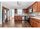 Updated kitchen featuring stainless steel appliances, dark wood cabinets, and stylish backsplash at 750 Ambrose Ln, Atlanta, GA 30349