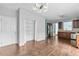 Open kitchen with hardwood floors, stainless steel appliances, dark wood cabinets and built-in pantry at 750 Ambrose Ln, Atlanta, GA 30349