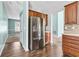 Modern kitchen with stainless steel refrigerator and dark wood cabinetry, providing ample storage at 750 Ambrose Ln, Atlanta, GA 30349