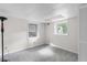 Basement bedroom with two windows and a closet with bifold doors at 1102 Rogeretta Ne Dr, Atlanta, GA 30329