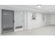 Finished basement with white walls, neutral carpet, and a sliding glass door to the outside at 1102 Rogeretta Ne Dr, Atlanta, GA 30329